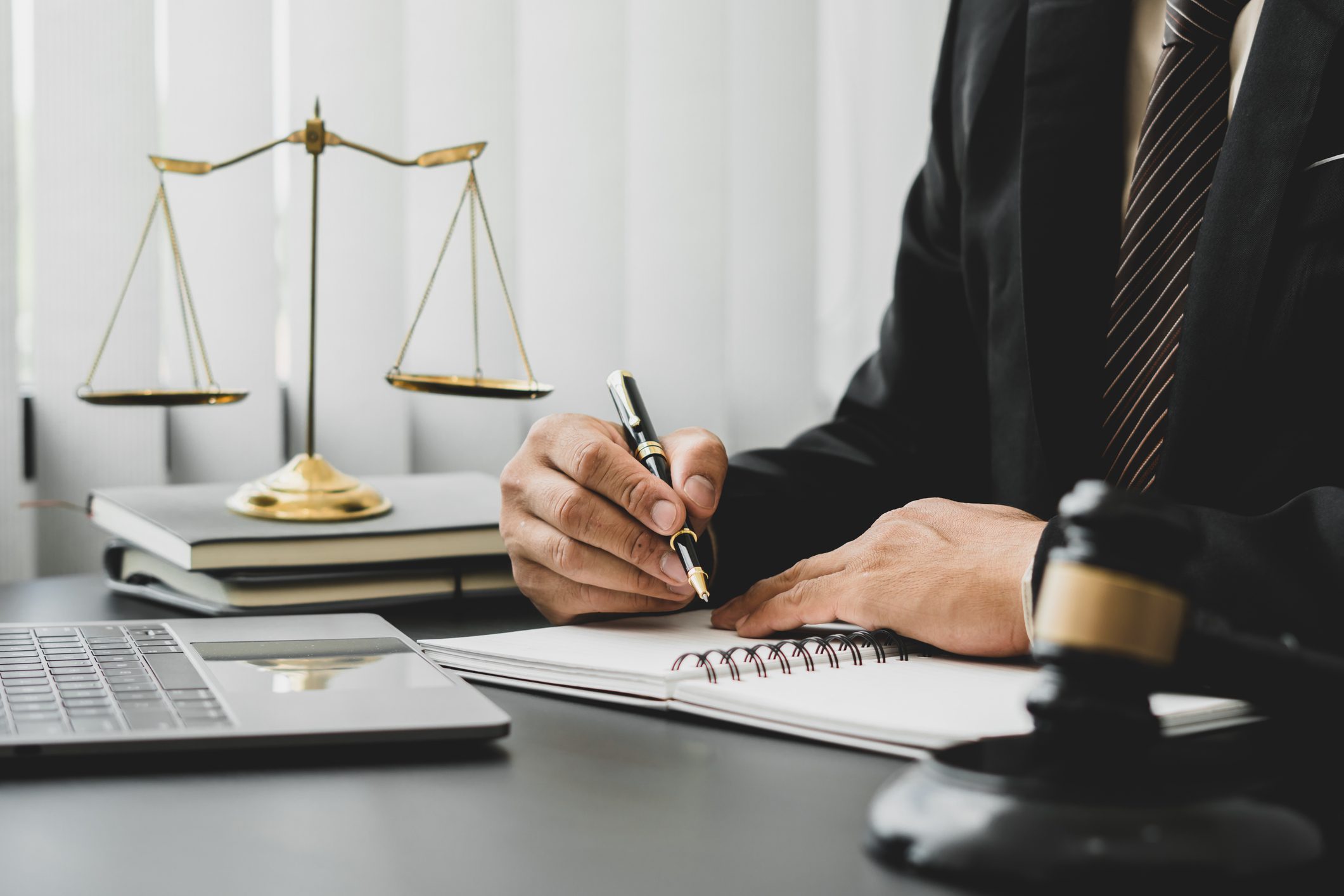 Businessman signing documents in office