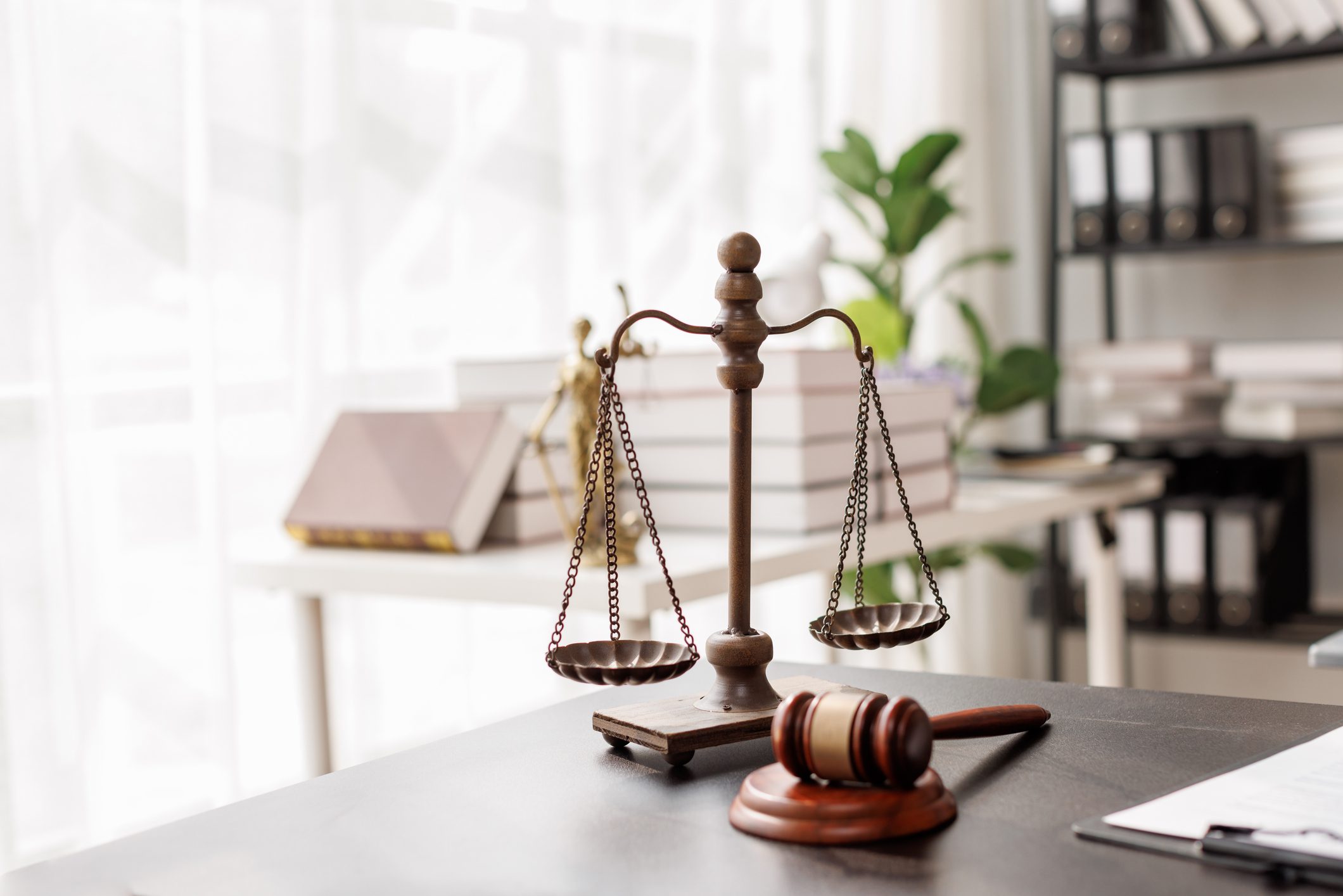 Legal gavel beside balanced scales